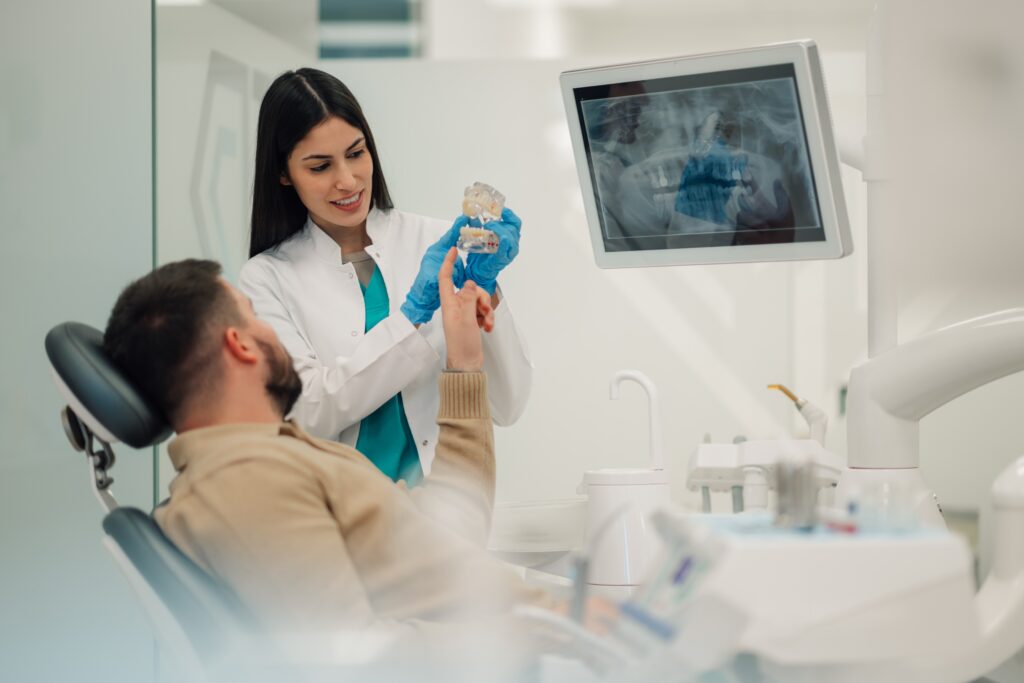 Orthodontist explaining treatment options to patient at Keyser Orthodontics in Raleigh