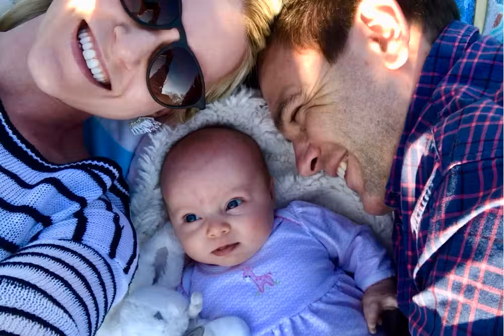 Young family enjoying healthy smiles with family orthodontic care in Raleigh