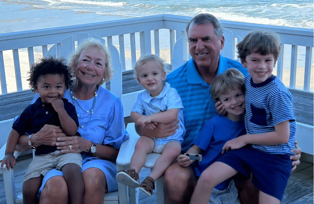 Happy family smiling after orthodontic treatment at Keyser Orthodontics in Knightdale NC